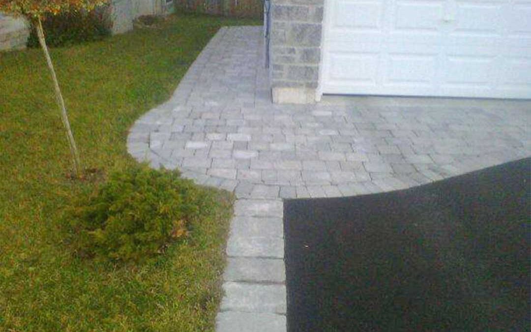 interlocking stone pathway and entrance to garage