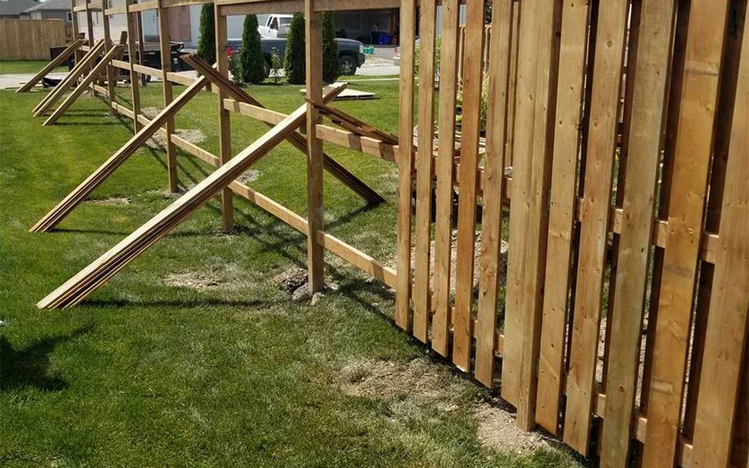 wooden fence being constructed