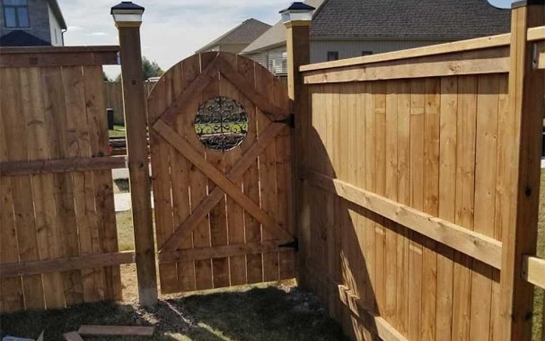 wooden fencing with gate being constructed