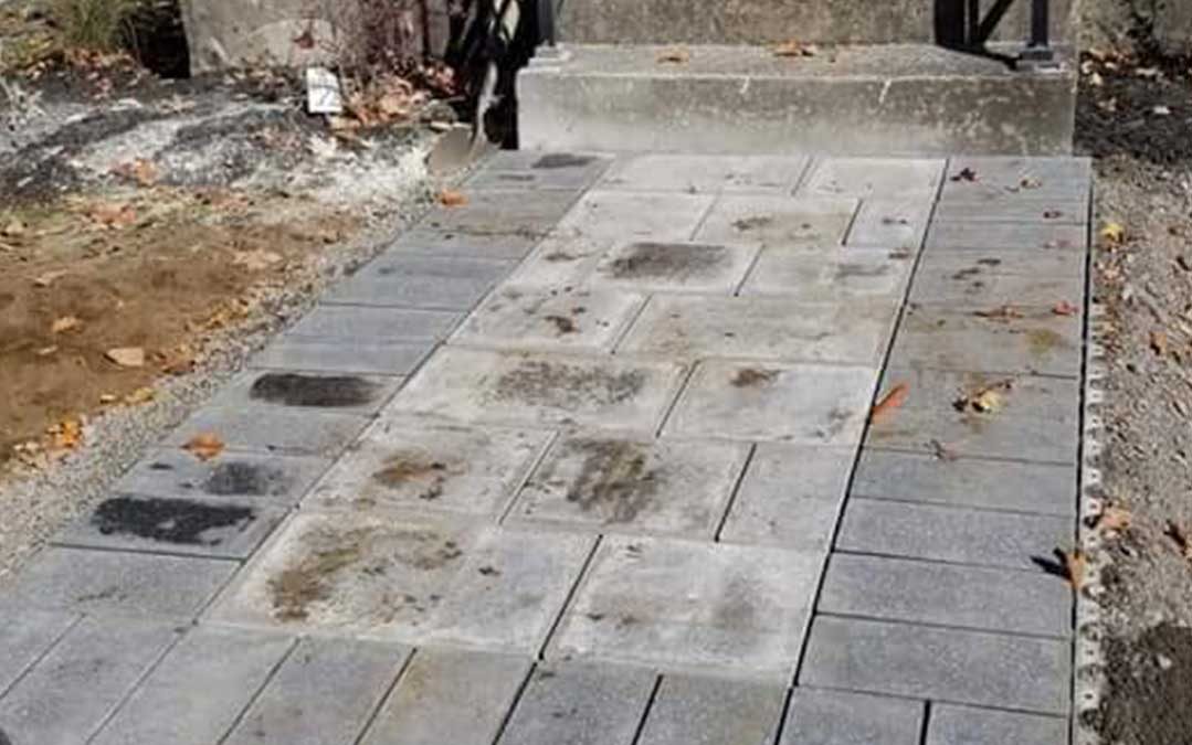 interlocking stone path leading to front door of residence