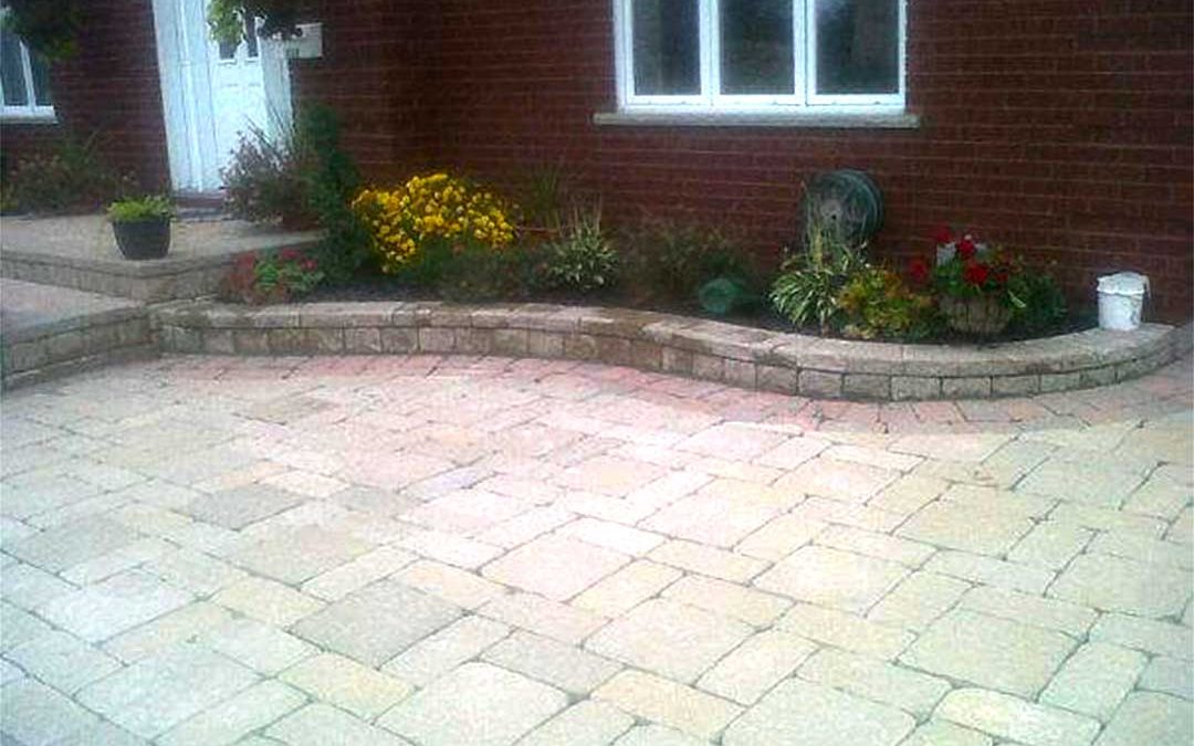 interlocking stone entrance with stone steps and retaining walls for garden