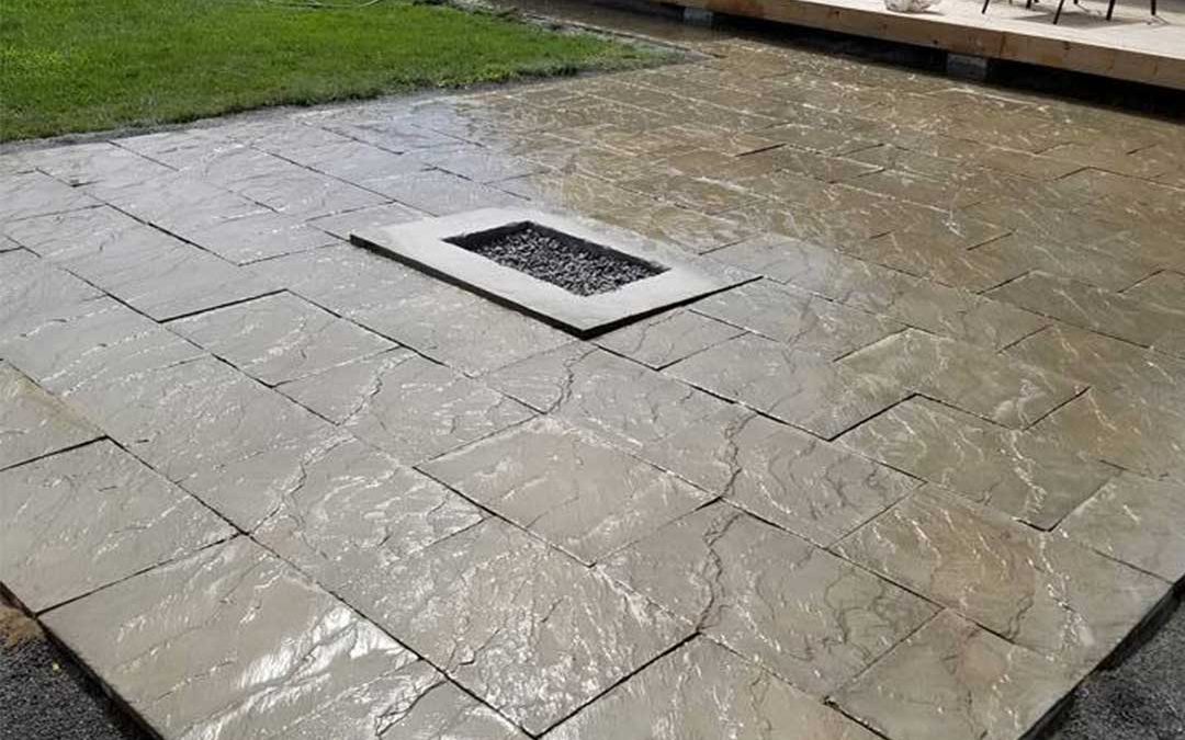 interlocking stone patio with fire burning area inset