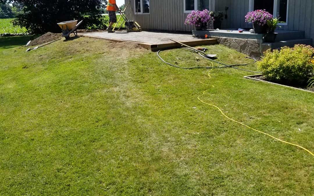 landscape construction of backyard with patio and gardens