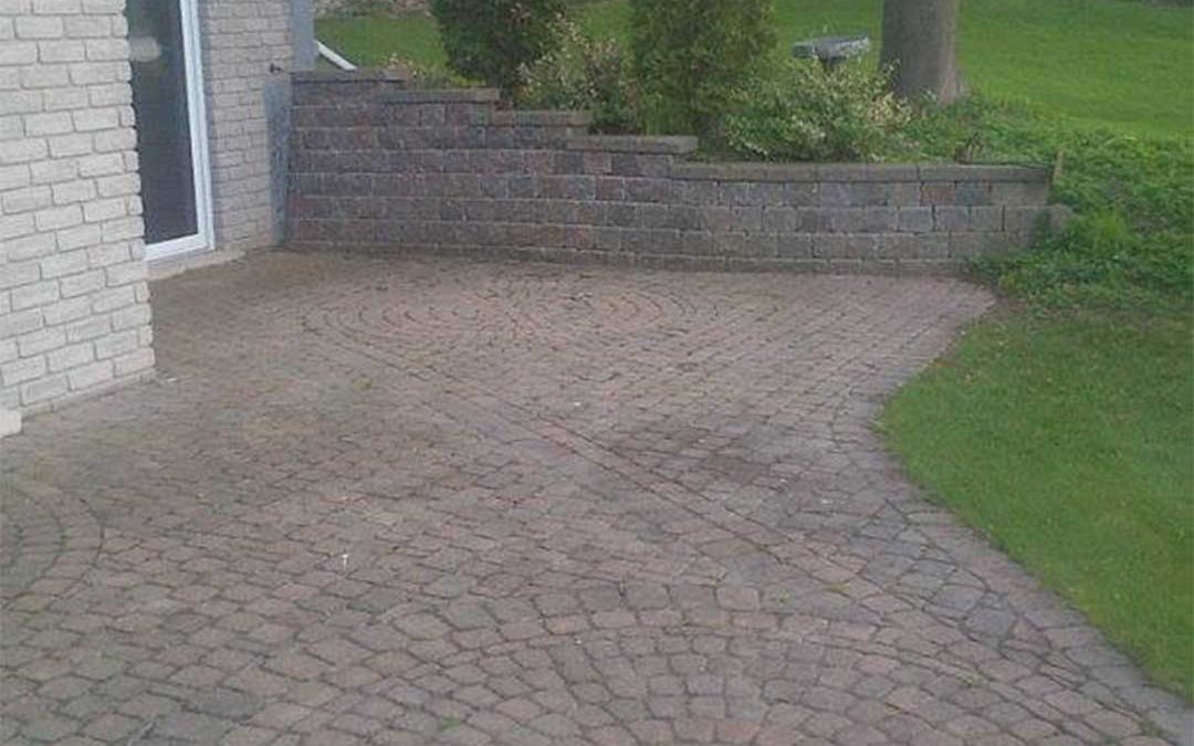 interlocking stone retaining wall and patio