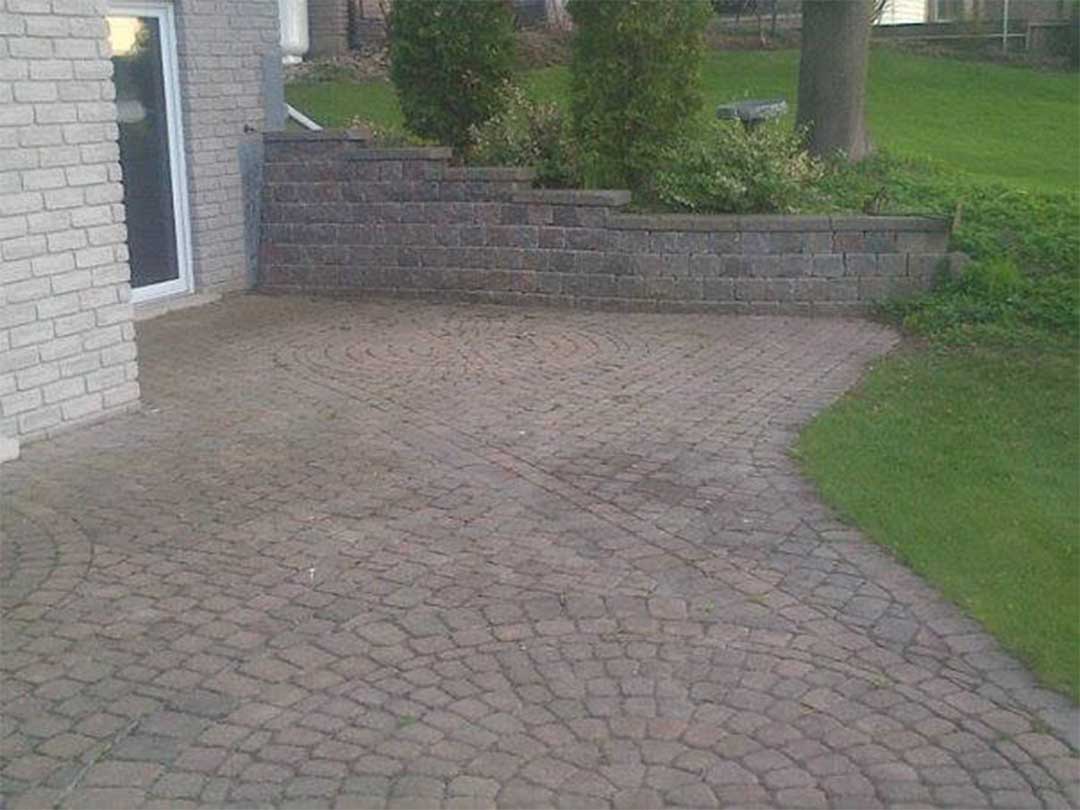 interlocking stone retaining wall and patio