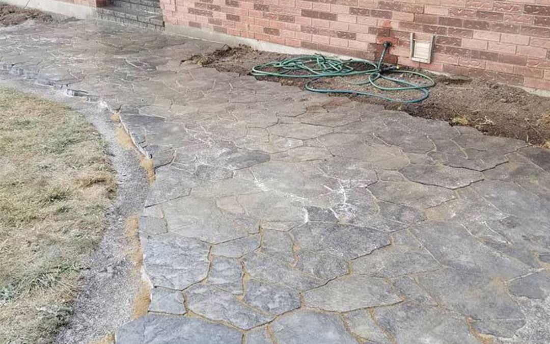 interlocking stone path leading to front door of residence